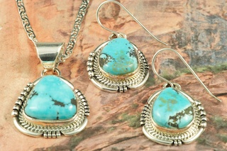Genuine Blue Moon Turquoise set in Sterling Silver. Stunning Pendant and Earrings Set. The Blue Moon Turquoise Mine is located in Esmeralda County, Nevada. It closed in the late 1970's. Blue Moon Turquoise is now obtained from private collections. The photo is of the jewelry you will be receiving. Created by Navajo Artist John Nelson. Signed by the artist.